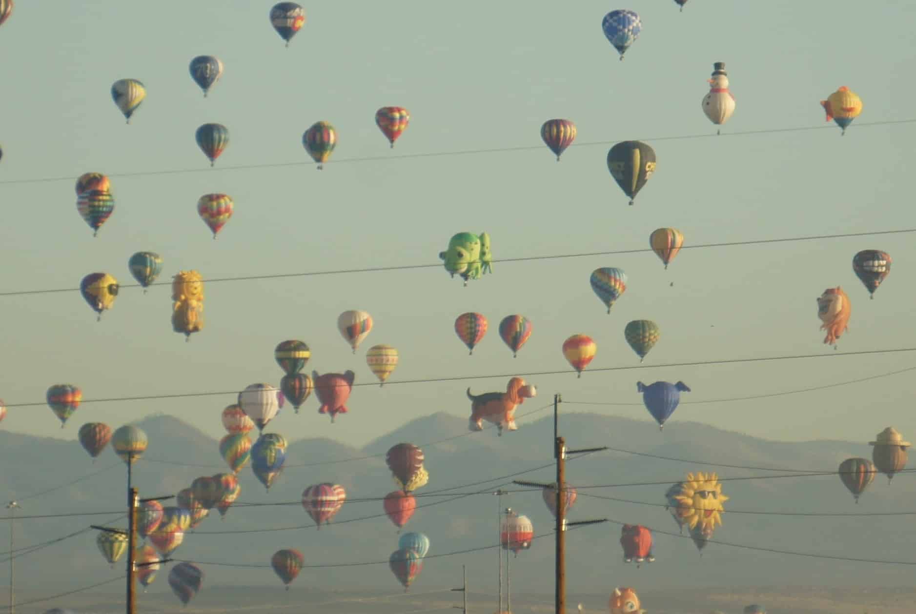 Balloons fill the sky